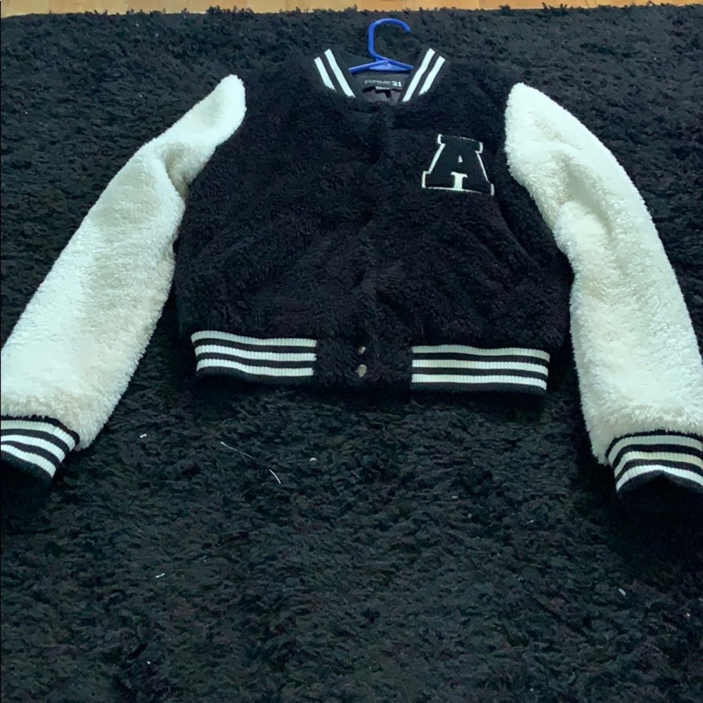 Fuzzy letterman jacket.